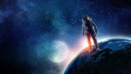 Wall Mural - astronaut in outer space. mixed media