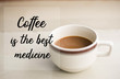 © nipol - Coffee is the best medicine words on cup of coffee on the table.