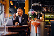 © Fxquadro - A man drinks coffee in a restaurant.