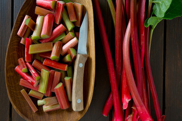 Canvas Print - rhubarb pieces on dark wooden surface