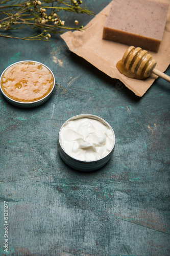 Fotografie, Obraz Close-up view of handmade soap, honey, dried flowers and cream for beauty care