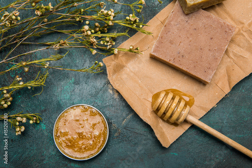 Fotografie, Obraz Close-up view of handmade soap, honey, dried flowers and cream for beauty care