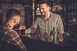 © Nejron Photo - Man chatting with a bartender in a pub