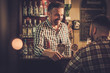 © Nejron Photo - Man chatting with a bartender in a pub