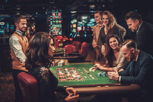 Upper Class Friends Gambling In A Casino