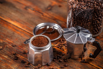 Ground coffee and moka pot