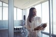 © WavebreakMediaMicro - Young businesswoman using digital tablet in office
