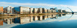 Modern buildings and offices on Liffey river in Dublin, panoramic image