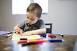 © Louis-Paul Photo - Young Boy Drawing on the kitchen table
