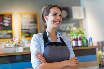 Wall Mural - Woman working in coffee shop
