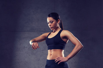 Sticker - young woman with heart-rate watch in gym