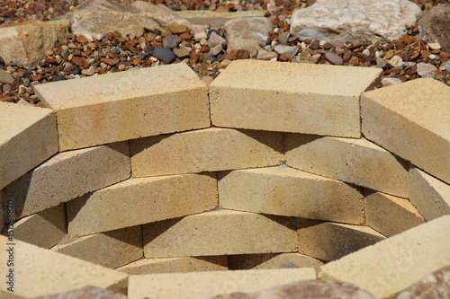 Fire Pit Made Of The Yellow Aluminous Bricks And Boulders
