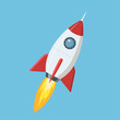 Flying cartoon rocket in flat style isolated on blue background. Vector illustration.