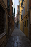Fototapeta Uliczki - A narrow venetian alley in Venice, Italy
