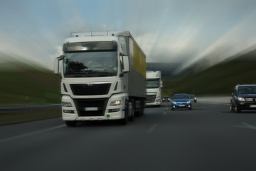 white truck racing on motorway