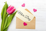 Fototapeta Młodzieżowe - Mother's day card with Swedish words: Mother's day. Tulip  and envelope on white wooden background