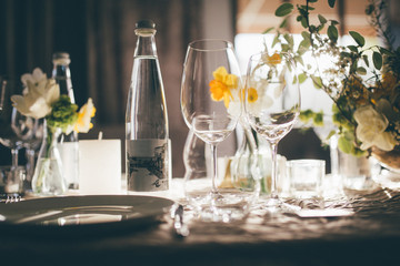 Table setting for dinner or banquet in restaurant on the sunset