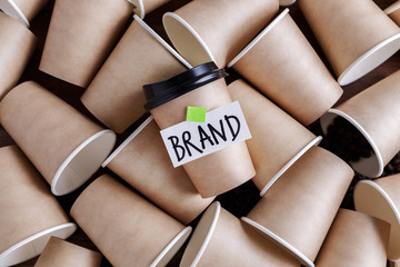 Wall Mural - coffee identity and brand building concept with lots of paper coffee cups background