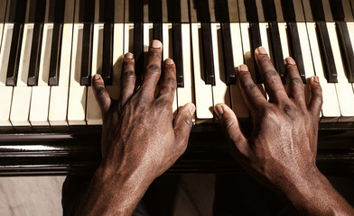 Wall Mural - Afro American man hands playing piano