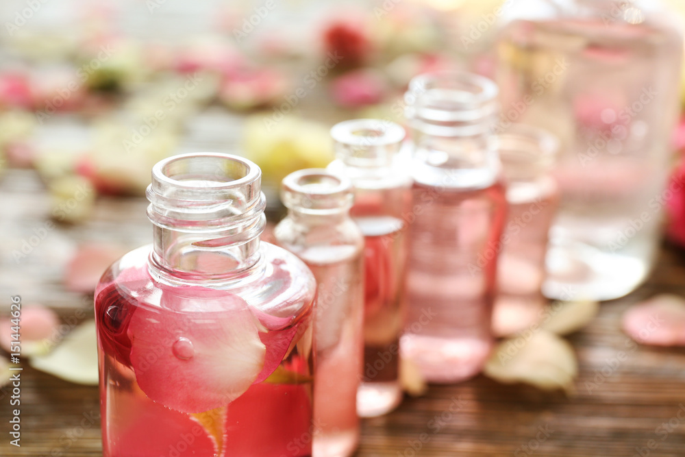 Perfume bottles on blurred background, closeup