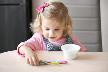 Poster - Cute little girl with yogurt at home