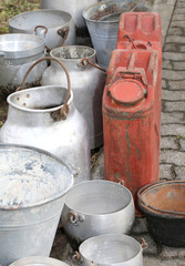 Wall Mural - bins and metal buckets used to transport the milk