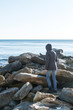 © familylifestyle - Woman walking on big stone at background