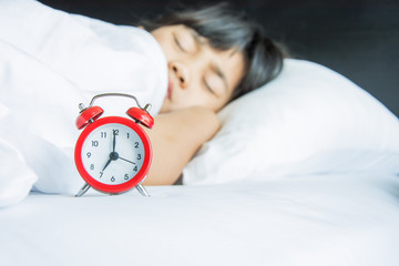 girl sleeping on the bed seven o’clock morning time