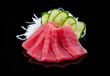 Tuna sashimi over black background,
