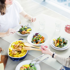 Wall Mural - Closeup of two women having lunch together