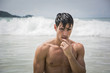 © theartofphoto - Handsome young man standing on a beach in Phuket Island, Thailand, shirtless wearing boxer shorts, showing muscular fit body