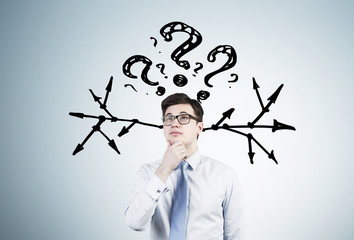 Wall Mural - Man in glasses, questions and arrows, gray