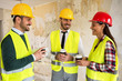 © didesign - Group of architects talking on coffee break at construction site