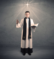 young priest in giving his blessing