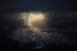 canvas print picture - Rays of light shining through dark clouds on another cloud layer for background