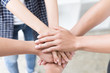 © 88studio - young college student joining hand, business team touching hands together - unity, harmony, teamwork, friends concept