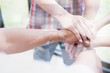 © 88studio - young college student joining hand, business team touching hands together - unity, harmony, teamwork, friends concept double exposure with chess