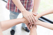 © 88studio - young college student joining hand, business team touching hands together - unity, harmony, teamwork, friends concept