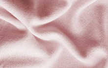 Surface Of A Soft Knitted Fabric Made Of Cashmere With Large Folds, A Detail Of Clothes