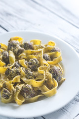 Canvas Print - Portion of creamy mushroom pasta with pesto