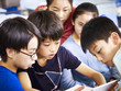 © imtmphoto - group of asian pupil using tablet together