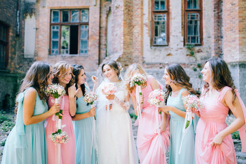 Beautiful bride with her pretty bridesmaids