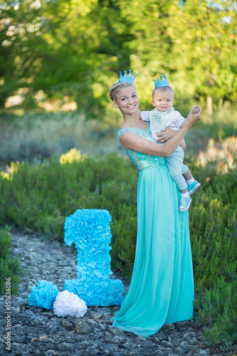 Beautifull Mother Lady Mom In Stylish Blue Dress Together With Her Son And Number One Birthday Beautifull Mother Lady Mom In Stylish Blue Dress Together With Her Son And Number One Birthday