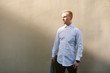 © Romvy - Portrait of young stylish man walking on the street of old city
