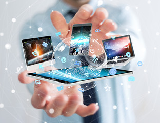 Aufkleber - Businessman connecting tech devices to each other 3D rendering
