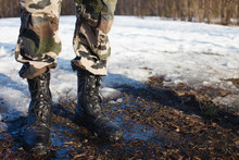 Dusty Army Boots On Dirty Ground