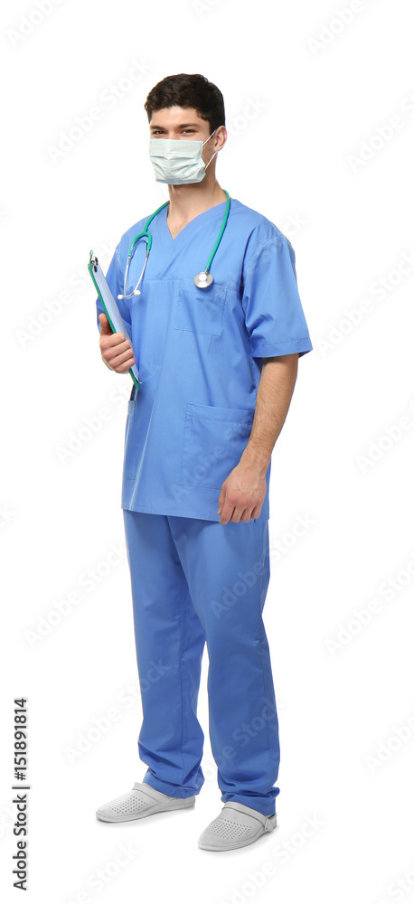Handsome young doctor with clipboard on white background