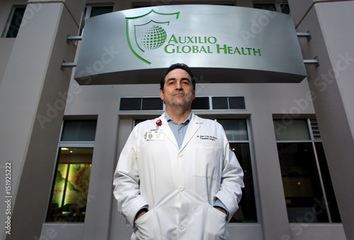 Surgeon Del Rio Poses For A Photograph At The Hospital Auxilio