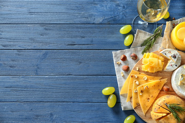 Wall Mural - Beautiful composition with variety of cheese on wooden background