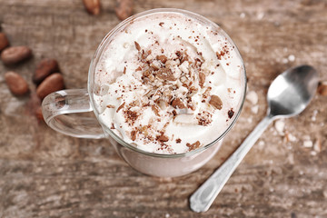 Poster - Glass cup of cocoa with whipped cream on wooden table